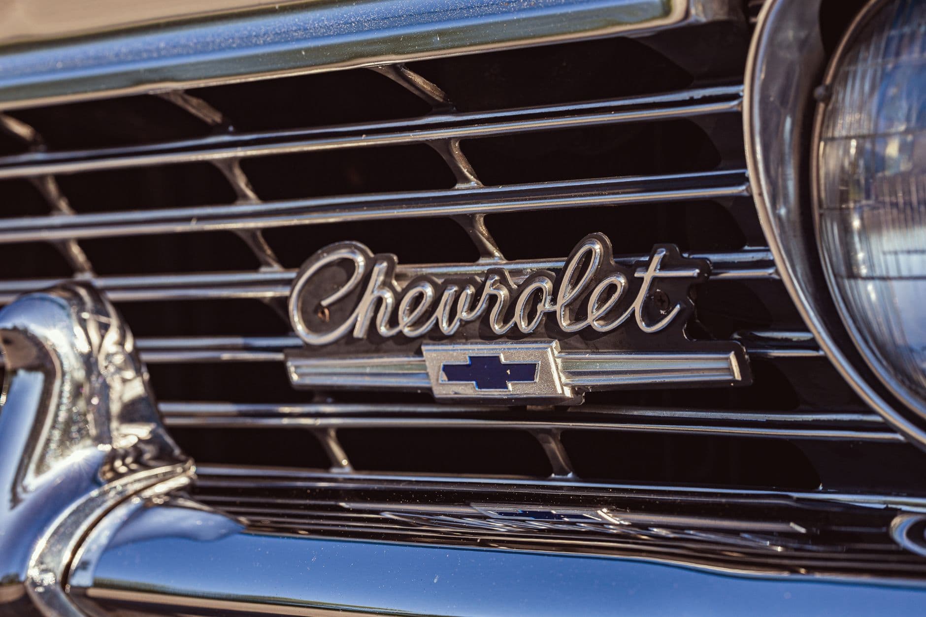 Detailed view of the iconic Chevrolet grille and emblem on a vintage 1966 Caprice.